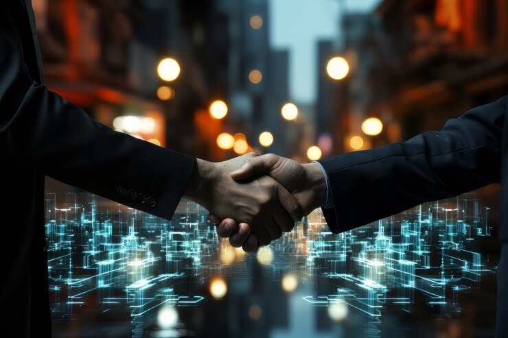 Two people in suits shake hands in front of a cityscape at night, with glowing digital graphics overlaying the scene, symbolizing technology and business partnership.